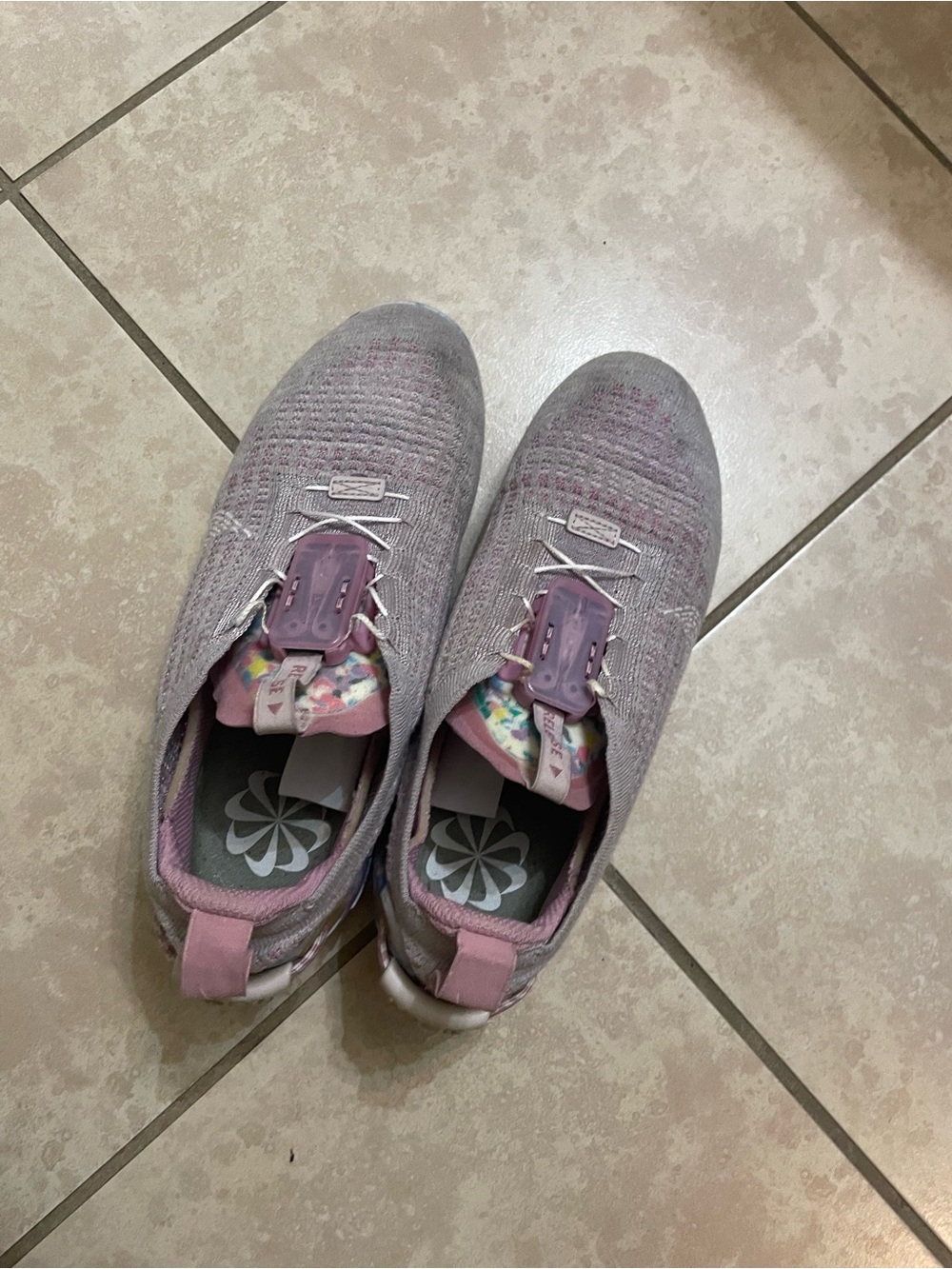 Nike Women's Light Pink Knit Slip-On Sneakers